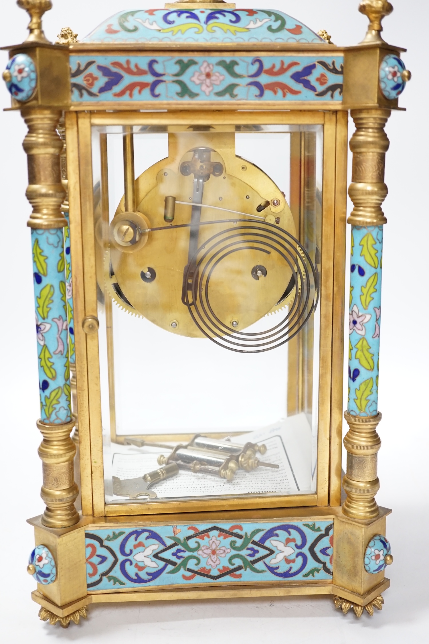 A champlevé four glass and brass mantel clock, with enamel dial, 45cm high